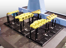 Spannsystem für Messmaschinen mit T-Nut-Platten